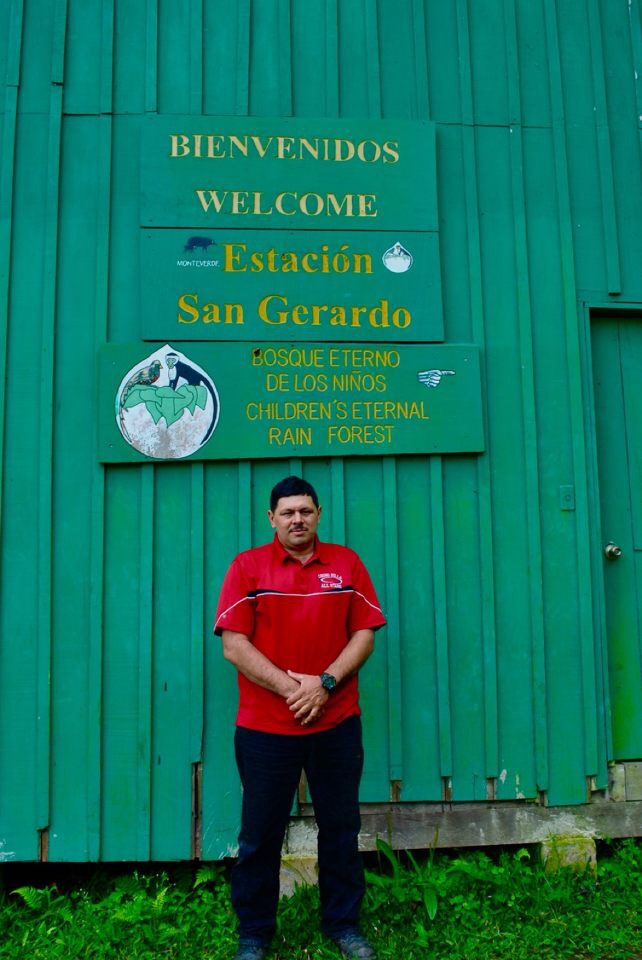 man in front of welcome sign at San Gerardo